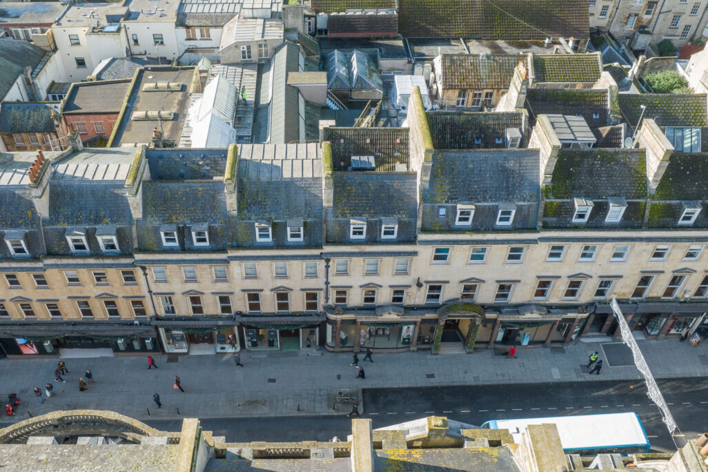 Aerial view facing West, of the historic building of Jolly's Department Store with surrounding shops visible along Milsom street in Bath, England