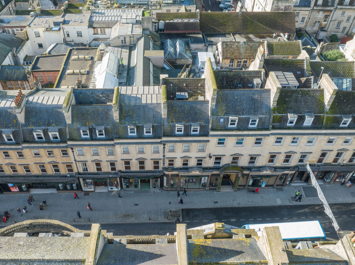 Aerial view facing West, of the historic building of Jolly's Department Store with surrounding shops visible along Milsom street in Bath, England